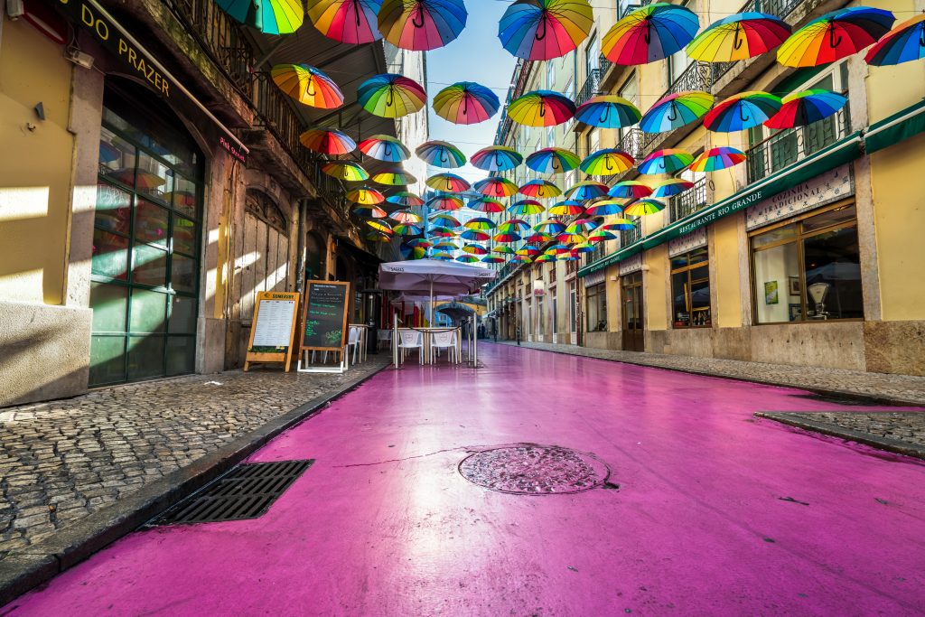 Pink Street Lisbon colourful umbrellas nightlife street Portugal