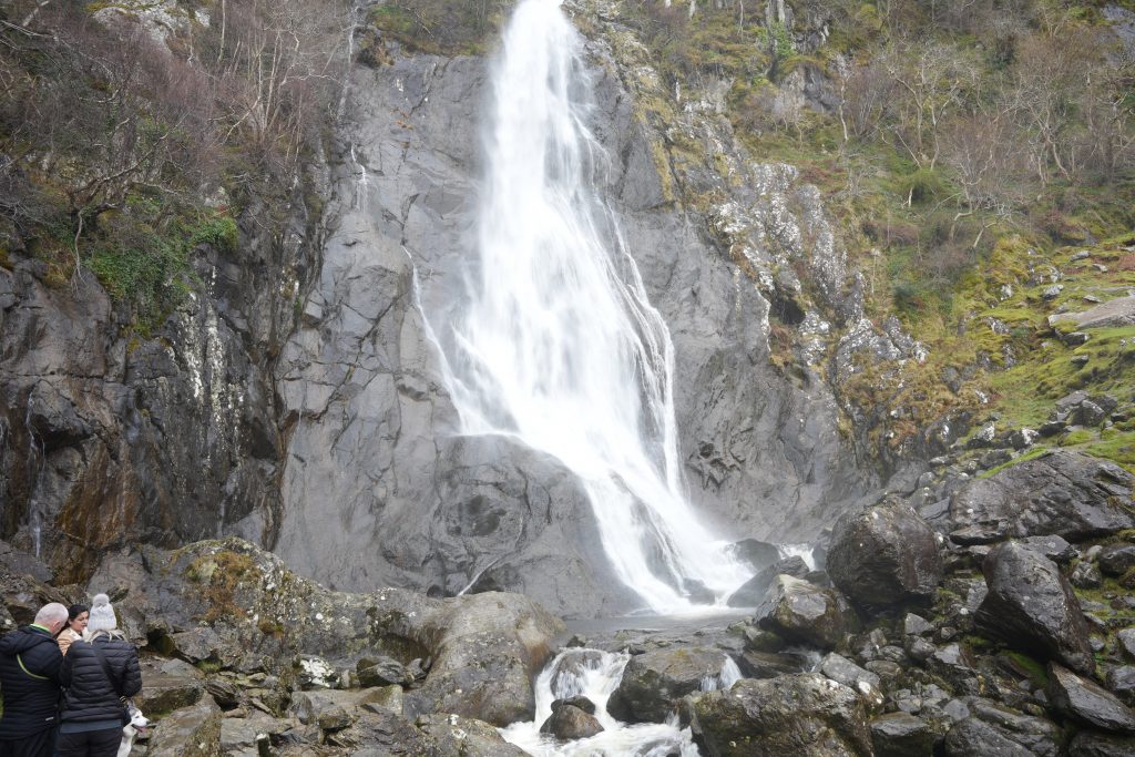 Aber Falls waterfall in Snowdonia North Wales flowing over rocks in a peaceful natural setting
