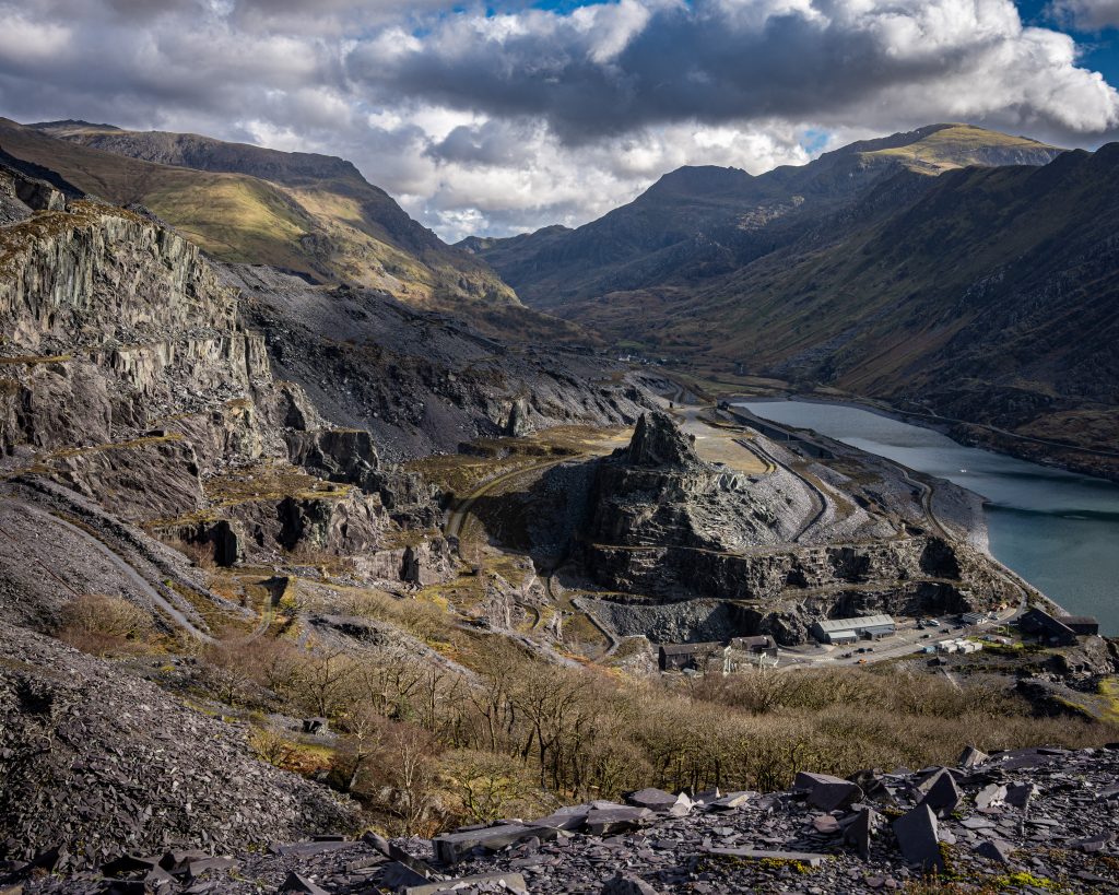 Dinorwig Quarry in Snowdonia North Wales with dramatic slate landscape, mountain peaks, and lake below