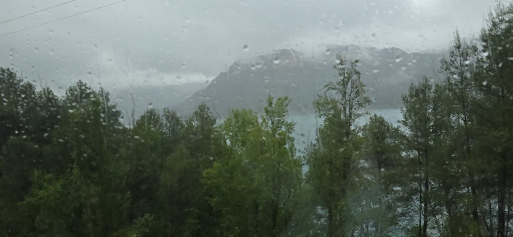 Rainy mountain scenery near Montanejos, Spain, viewed through a vehicle window